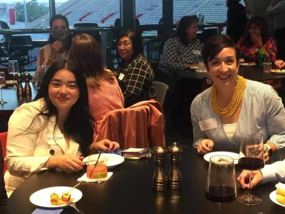 Group of 4 people sitting at a round table