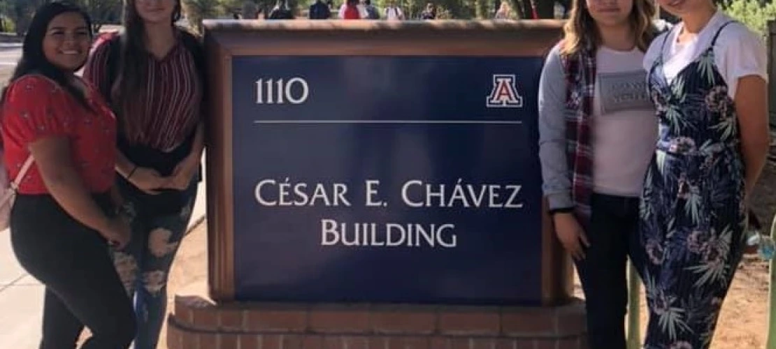 Ajo HS Students visiting UA and posing in front of the Cesar Chavez Sign  