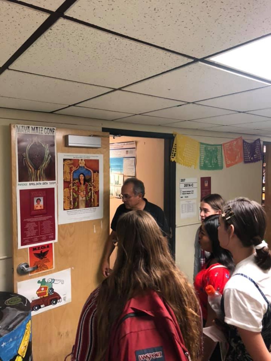 Ajo students visiting UA and speaking with faculty from the Mexican American Studies Department